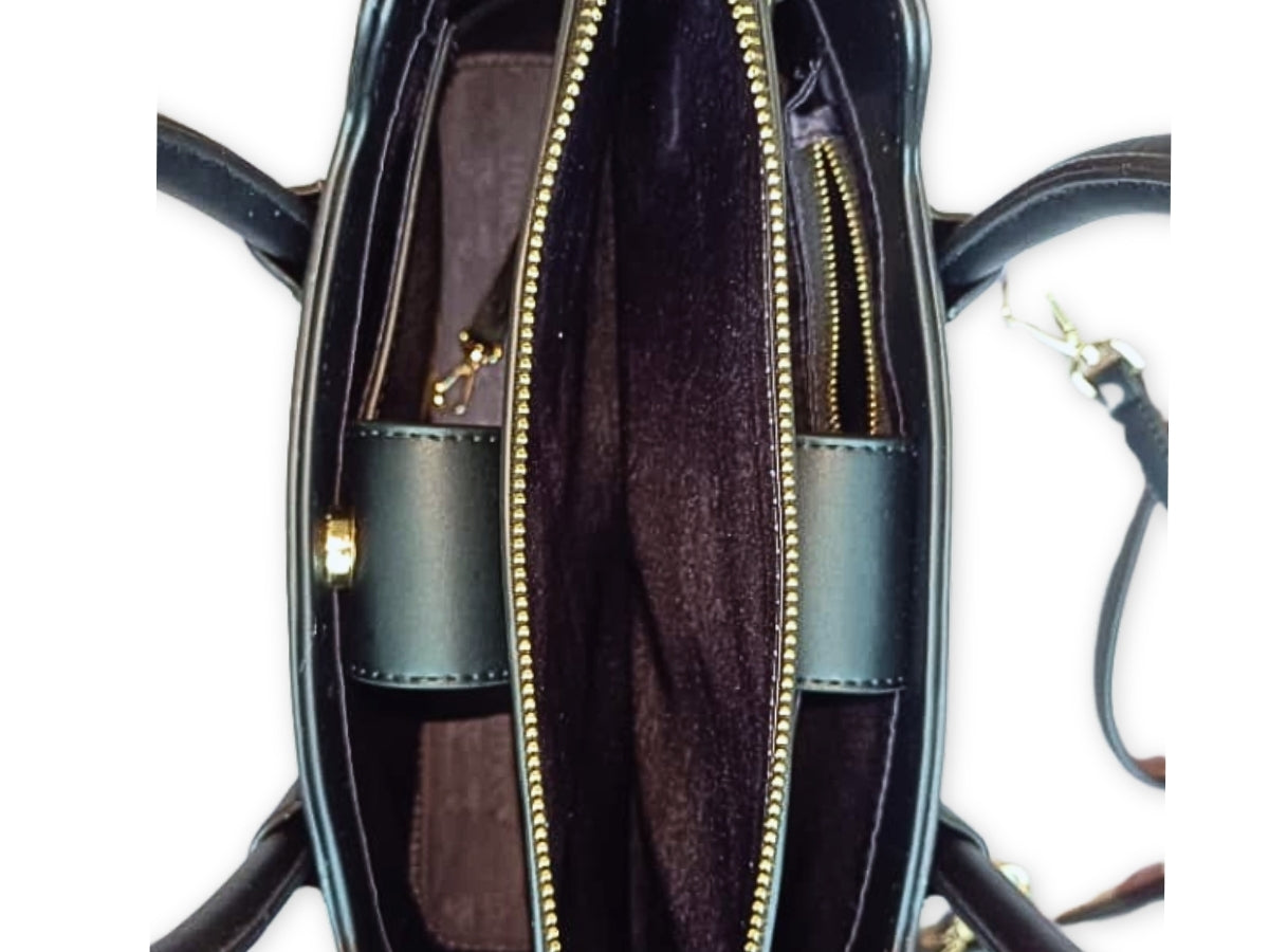 Interior view of Black CSWAN handbag showing structured compartments and signature monogram lining