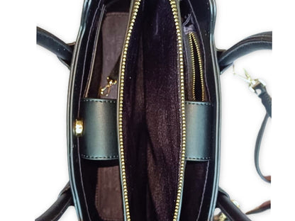 Interior view of Black CSWAN handbag showing structured compartments and signature monogram lining