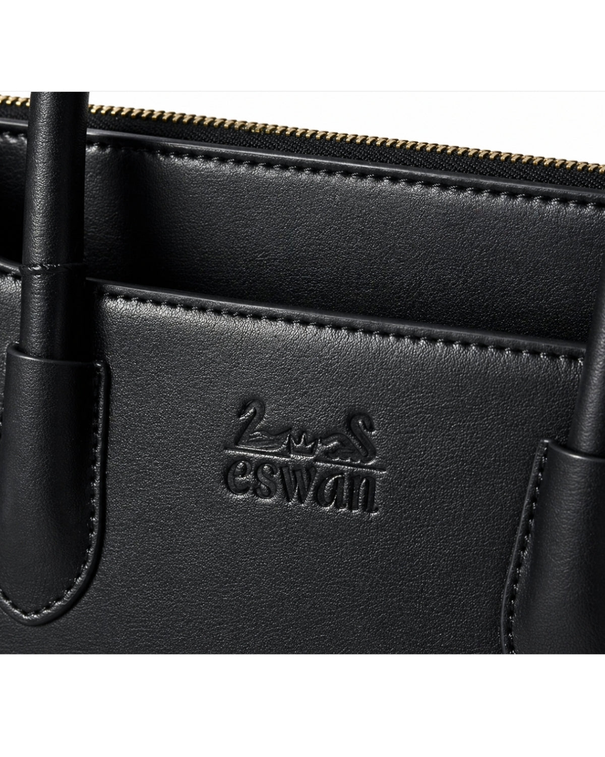 Close-up of Black CSWAN Tote featuring embossed logo, smooth leather texture, and refined craftsmanship detailing