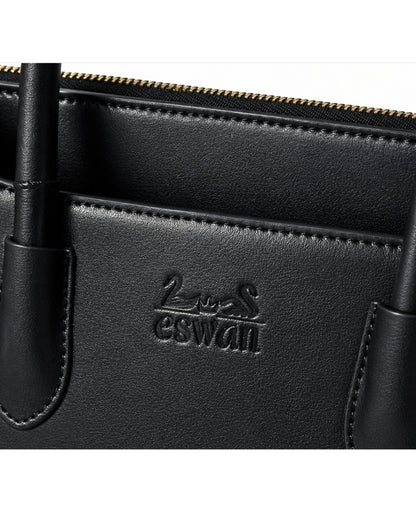 Close-up of Black CSWAN Tote featuring embossed logo, smooth leather texture, and refined craftsmanship detailing
