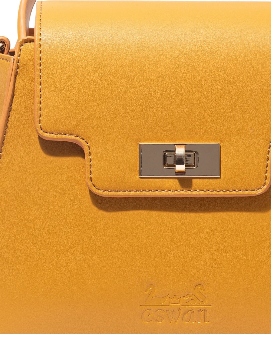 Close-up of Camel Tundra – CSWAN handbag showing leather texture, stitching, and gold clasp detail