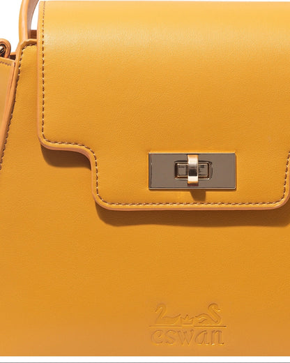 Close-up of Camel Tundra – CSWAN handbag showing leather texture, stitching, and gold clasp detail