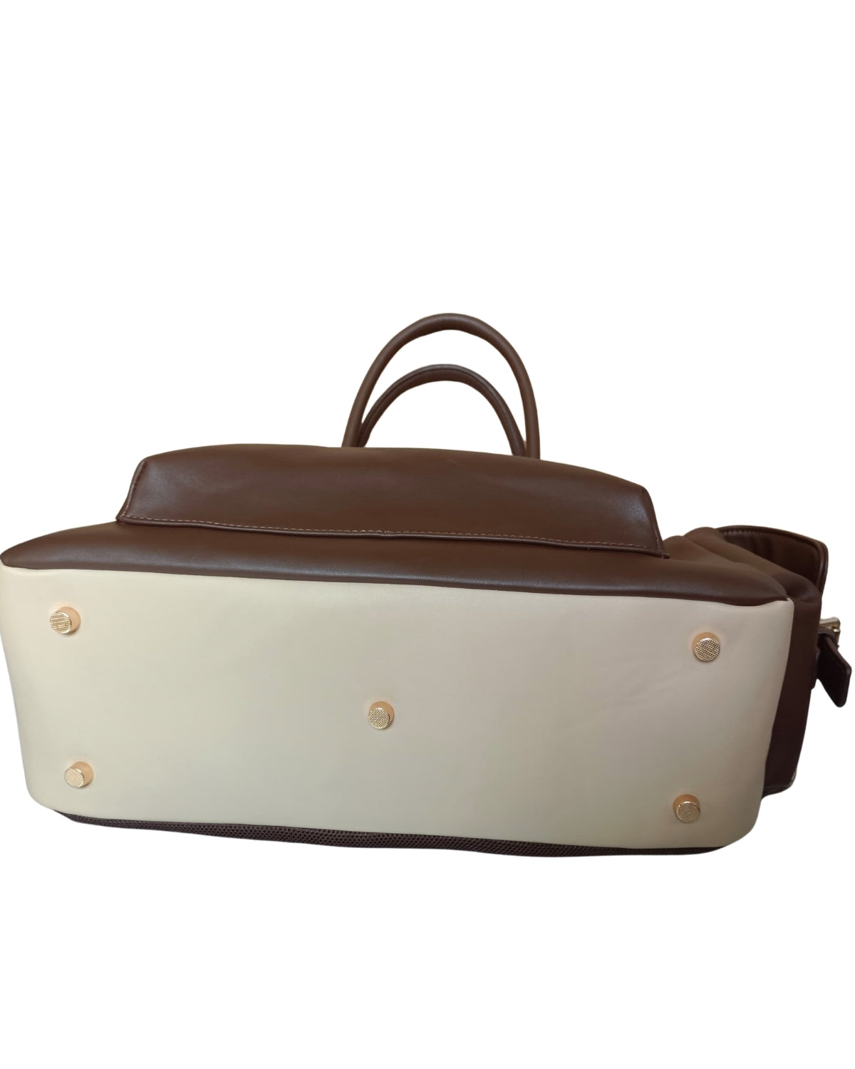 Bottom view of Espresso Brown CSWAN convertible backpack showing reinforced base and protective gold-tone feet