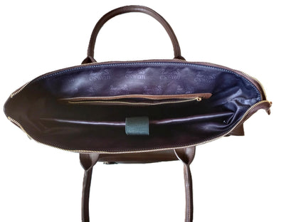Interior view of Espresso Brown CSWAN convertible backpack featuring spacious compartments, deep laptop storage pockets, zip compartment, and signature monogram lining