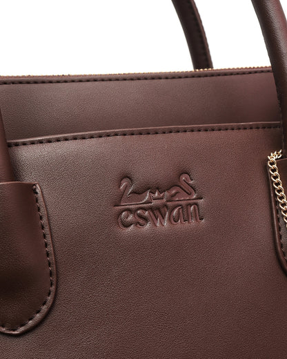 Close-up of Espresso Brown CSWAN medium tote showcasing embossed logo, leather texture, and stitching craftsmanship